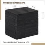 Stack of 100 black FELISTORY disposable non-woven massage table sheets, folded neatly.