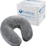 Stack of 50 clear, fitted disposable headrest covers for massage tables, neatly packed in a box.