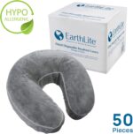 Stack of 50 clear, fitted disposable headrest covers for massage tables, neatly packed in a box.