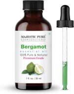 Amber glass bottle of Majestic Pure Bergamot Essential Oil with a built-in dropper, 1 fl oz size, on a white background.