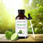 Amber glass bottle of Majestic Pure Bergamot Essential Oil with a built-in dropper, 1 fl oz size, on a white background.