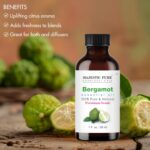Amber glass bottle of Majestic Pure Bergamot Essential Oil with a built-in dropper, 1 fl oz size, on a white background.