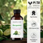 Amber glass bottle of Majestic Pure Bergamot Essential Oil with a built-in dropper, 1 fl oz size, on a white background.