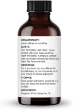 Amber glass bottle of Majestic Pure Bergamot Essential Oil with a built-in dropper, 1 fl oz size, on a white background.
