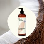 A clear bottle of Plant Therapy Fractionated Coconut Oil, 16 fl oz, with a white label, on a clean background.