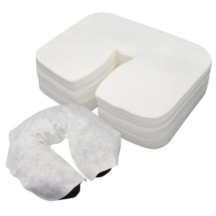 Stack of 200 white disposable face cradle covers made of soft cotton, designed for massage tables and spa chairs.