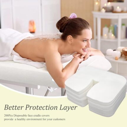 Stack of 200 white disposable face cradle covers made of soft cotton, designed for massage tables and spa chairs.
