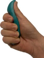 A green, thumb-shaped plastic massage tool designed for deep tissue and trigger point therapy, held in a hand.
