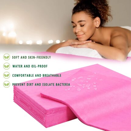 Stack of 100 individually folded pink disposable massage table sheets, made of non-woven fabric, ready for use.
