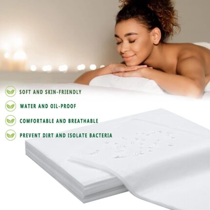 Stack of 100 white disposable bed sheets for massage and spa tables, neatly folded.