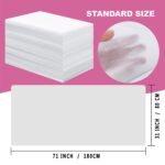 Stack of 100 white disposable bed sheets for massage and spa tables, neatly folded.